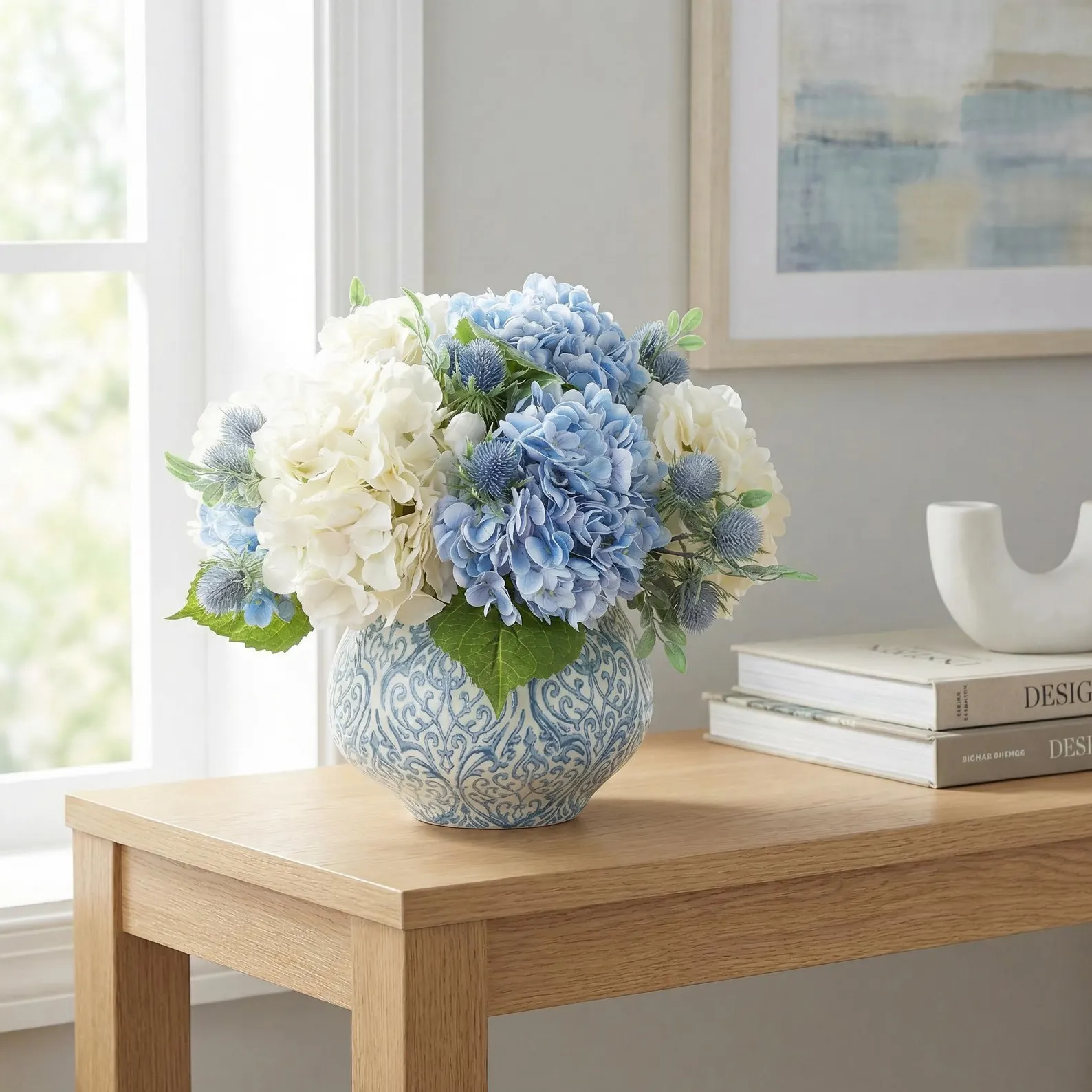 Hydrangea & Thistle Centerpiece in Decorative Blue & White Vase